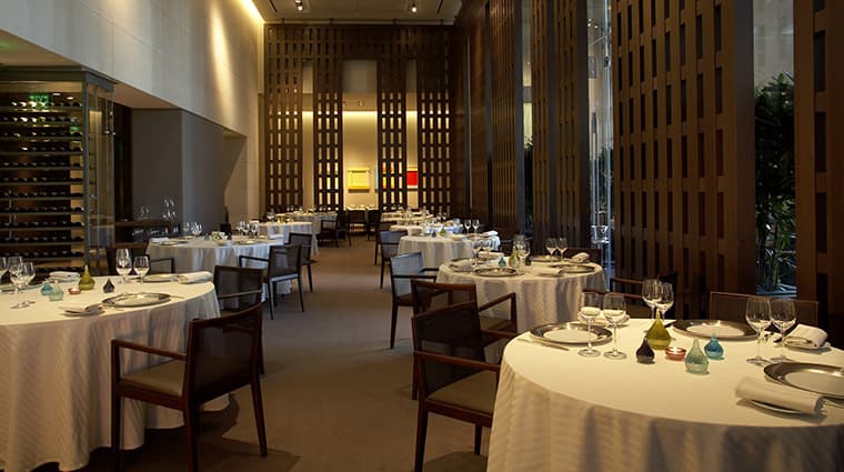 Restaurant Guy Savoy in Las Vegas — Guy Savoy's two-Michelin-star French tasting room at Caesars Palace — artichoke soup with black truffle and a table overlooking the Forum Shops